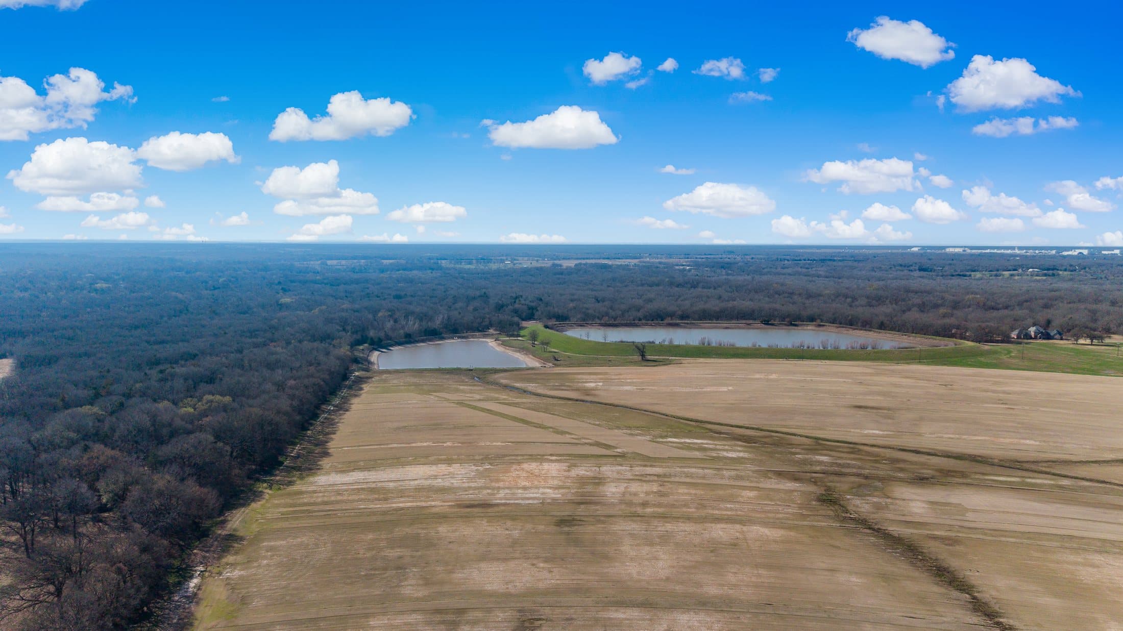 Drone perspective on production fields and adjacent improvements at the primary site
