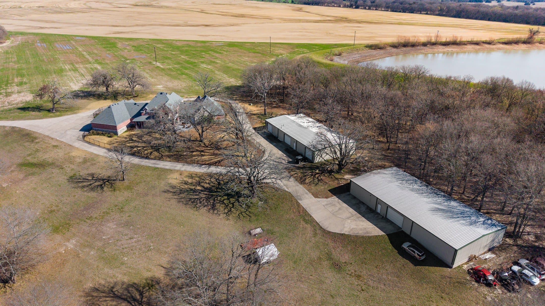 Aerial showing the primary site’s scale, pond, and headquarters area