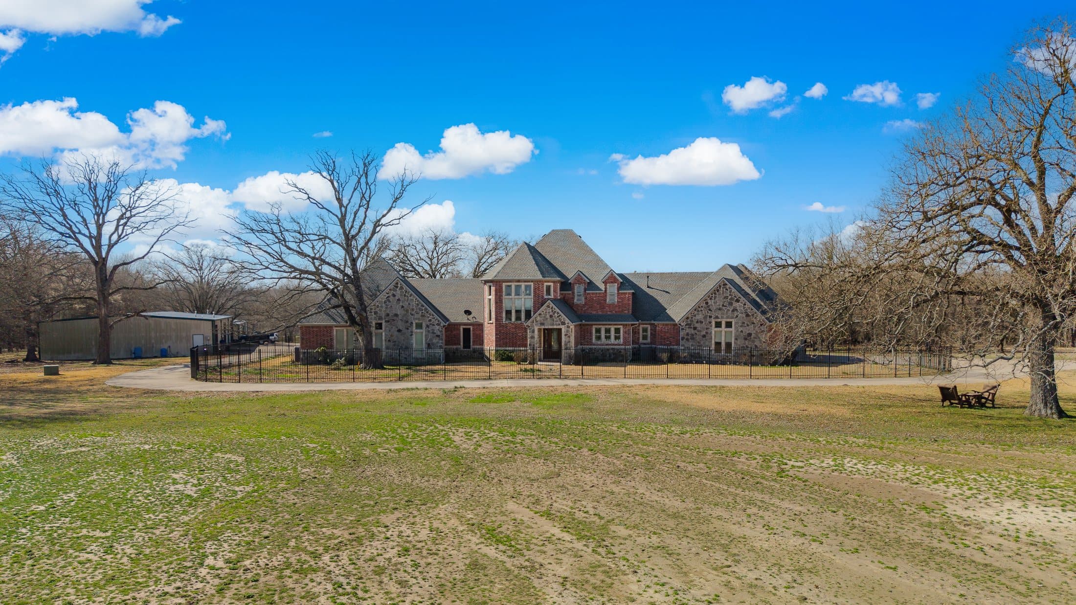 High aerial of the primary site looking back toward the residence and shops