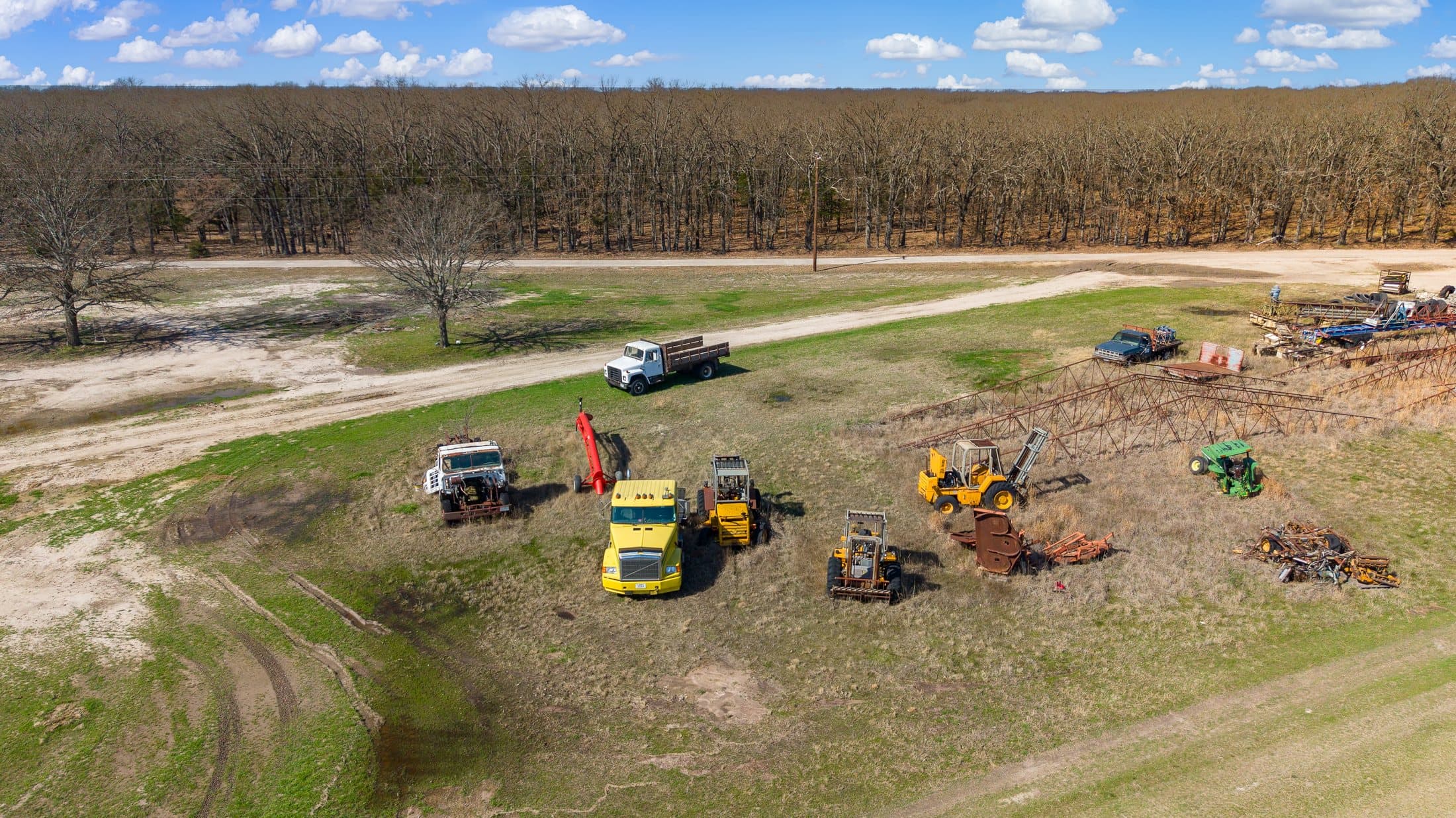 Ground-level view of operating equipment staged at the primary site yard
