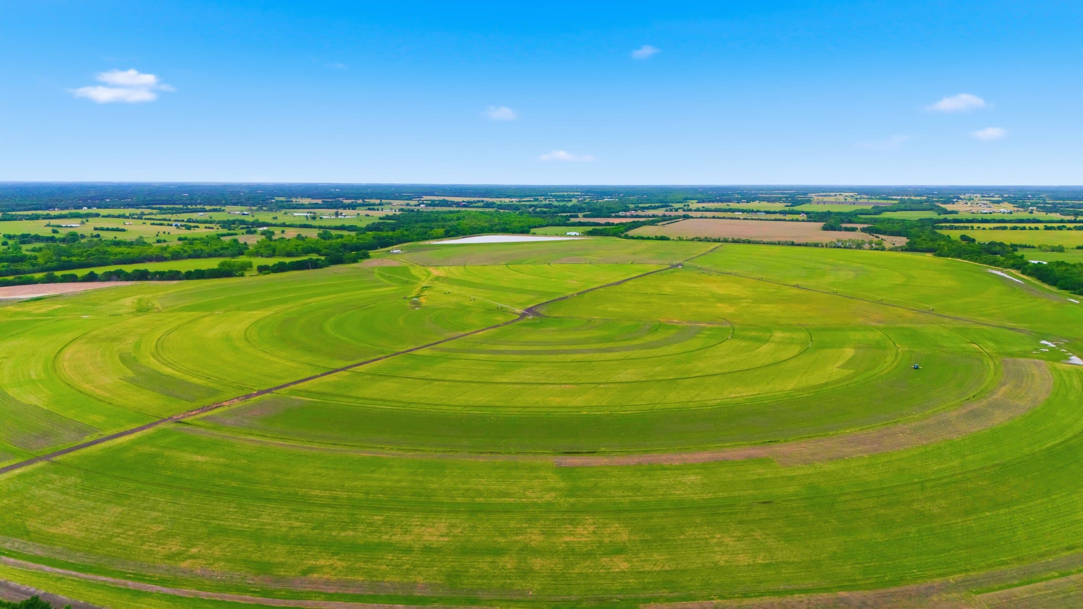 Aerial showing the irrigation pond and pivot fields at the 377 CR 1003 second site
