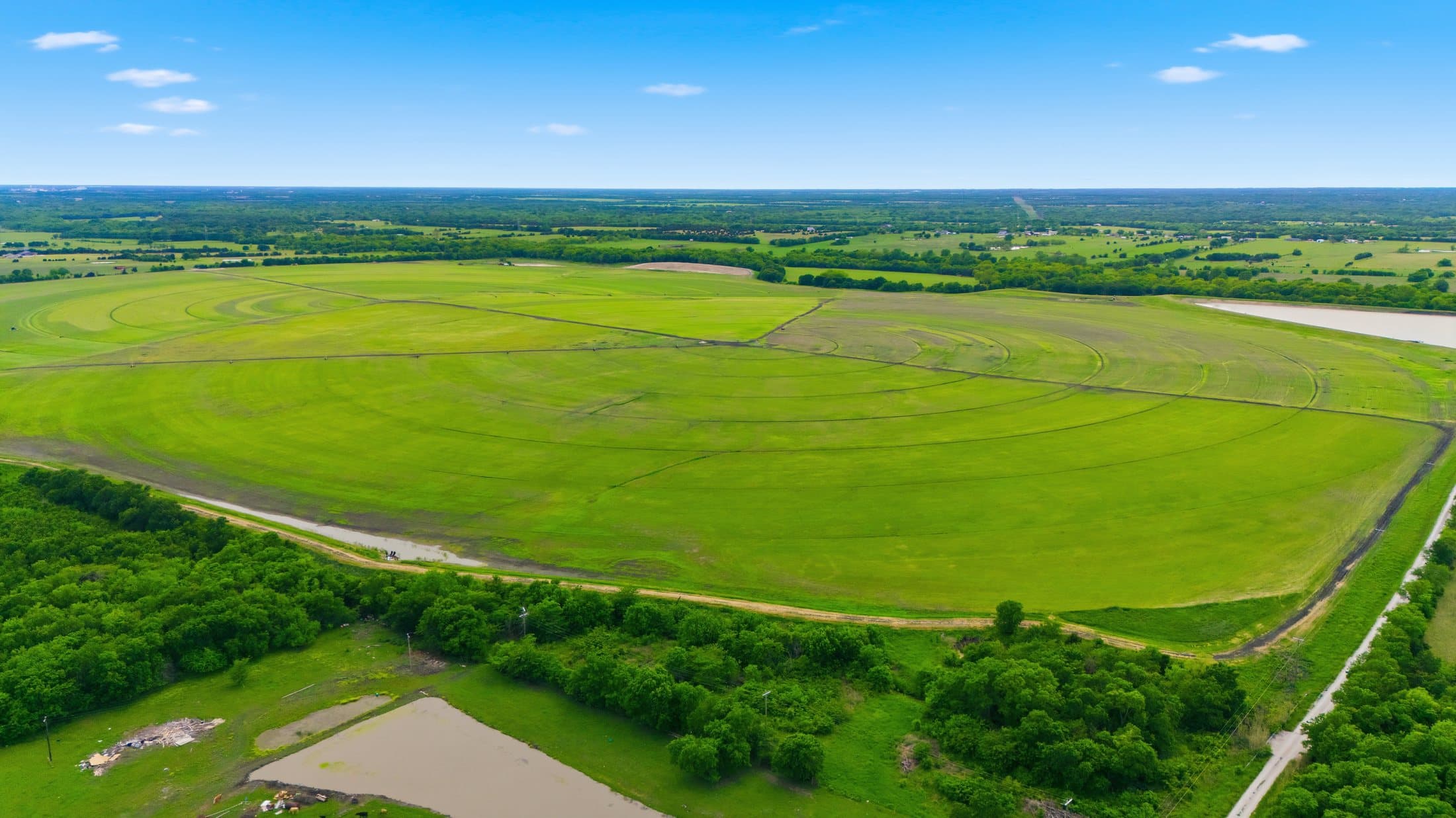 Aerial showing pivot tracks and pond infrastructure at the second site