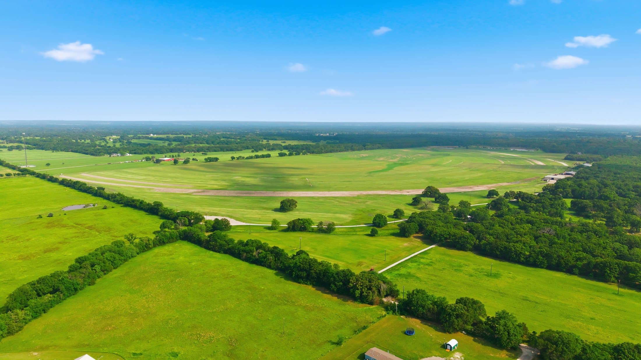 Summer aerial of cropped grass blocks at the primary site