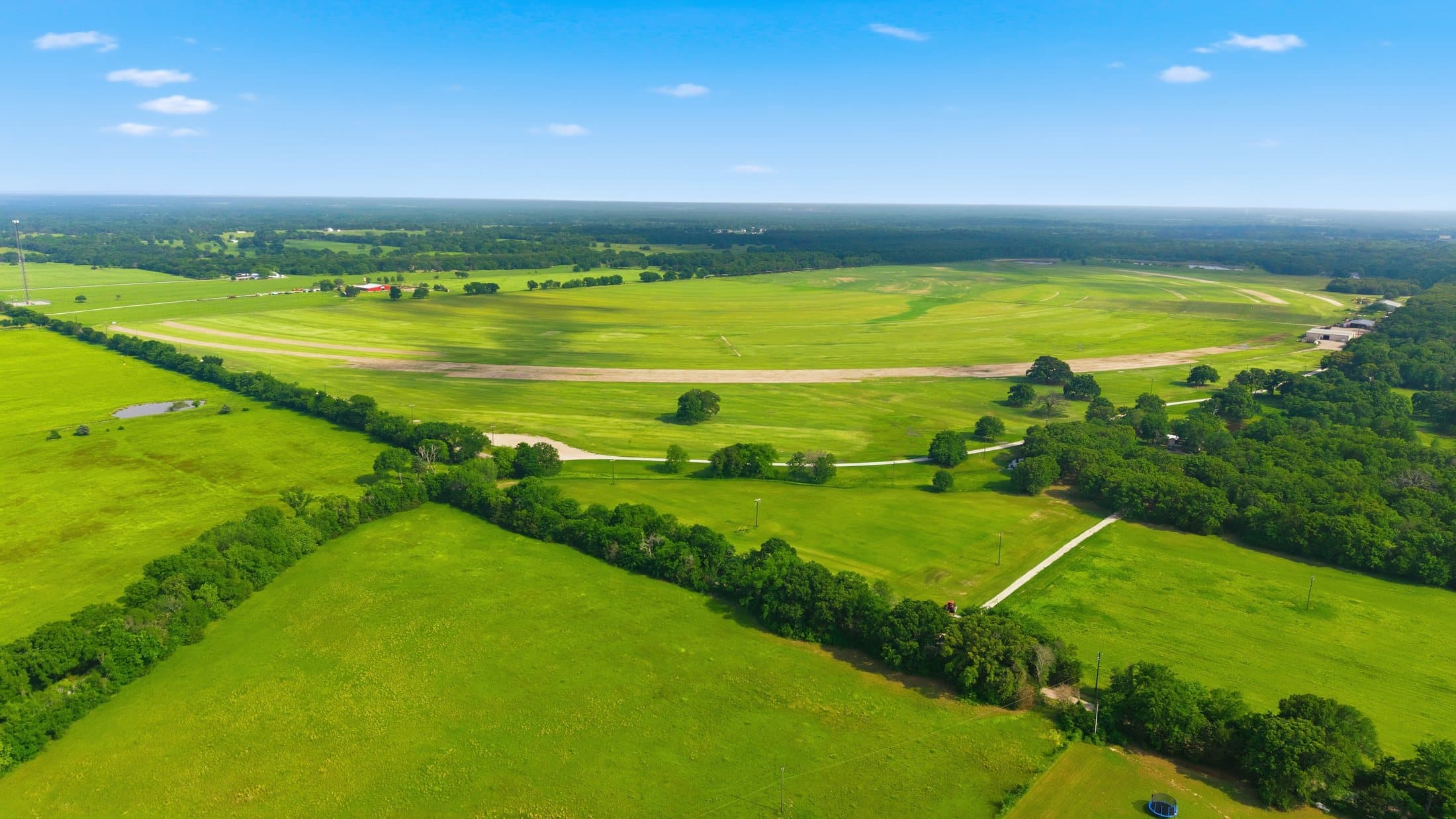 High summer aerial showing pivot tracks at the primary site
