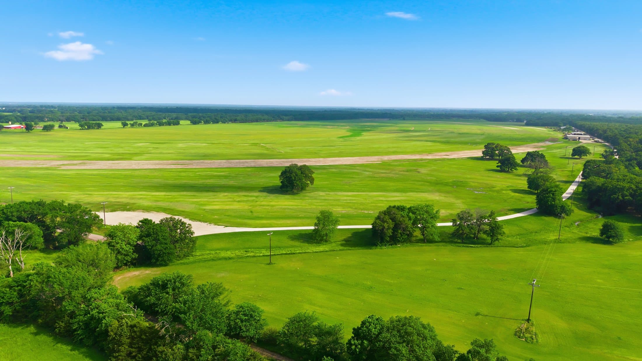 Summer aerial of the primary production fields with adjacent grazing land